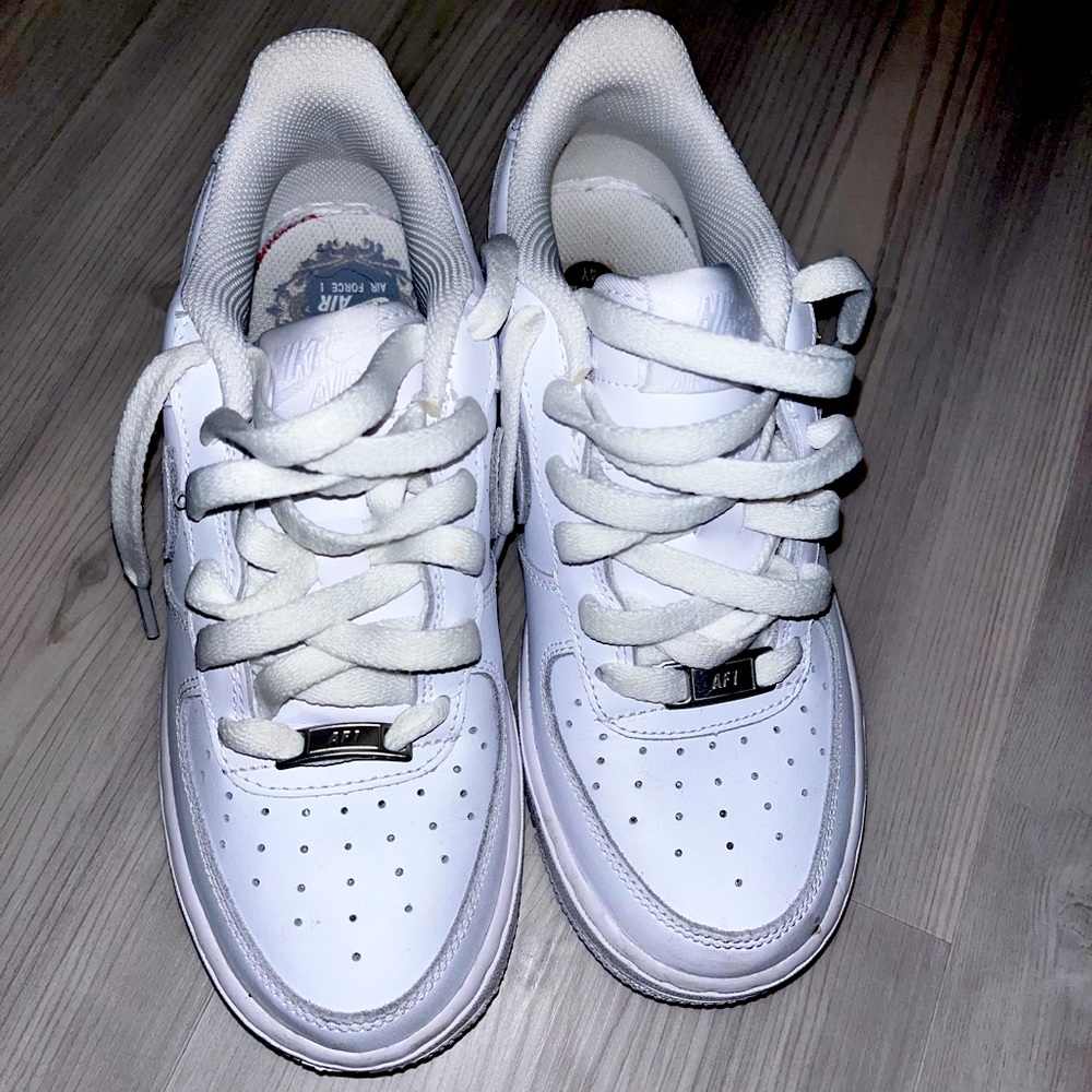 White Nike Air Force ones.
